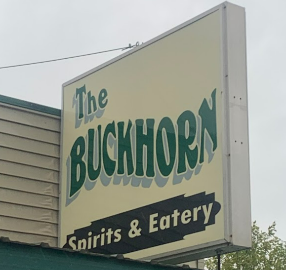 The BuckHorn Bar and Grill sign from street view.