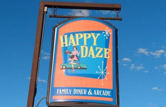 Happy Daze Family Diner & Arcade street sign.