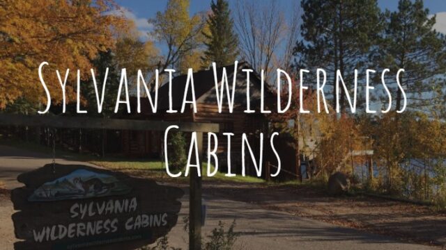 Sylvania Wilderness Cabins front page logo overlaying a picture of the streetview of the cabins.